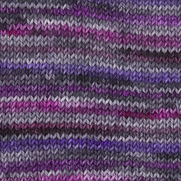 close up knitted sample of self striping sock yarn with purples, plums and silver