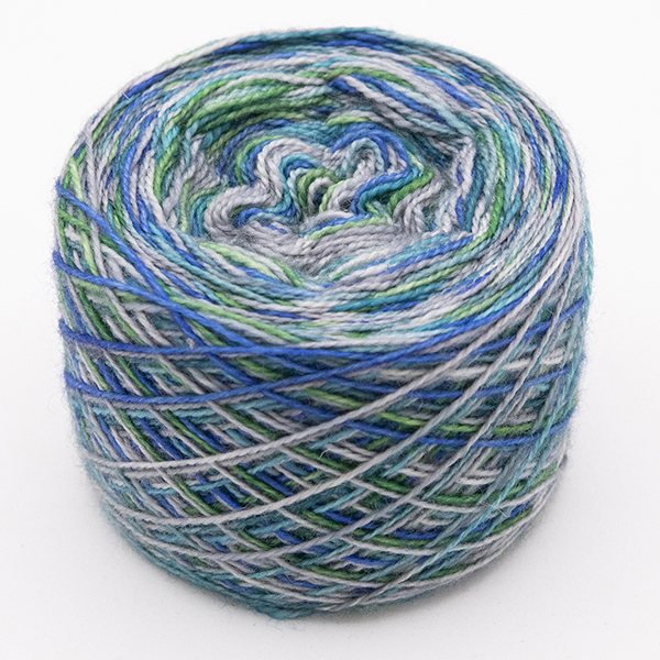 ball of self striping sock yarn with greens, blues and silver
