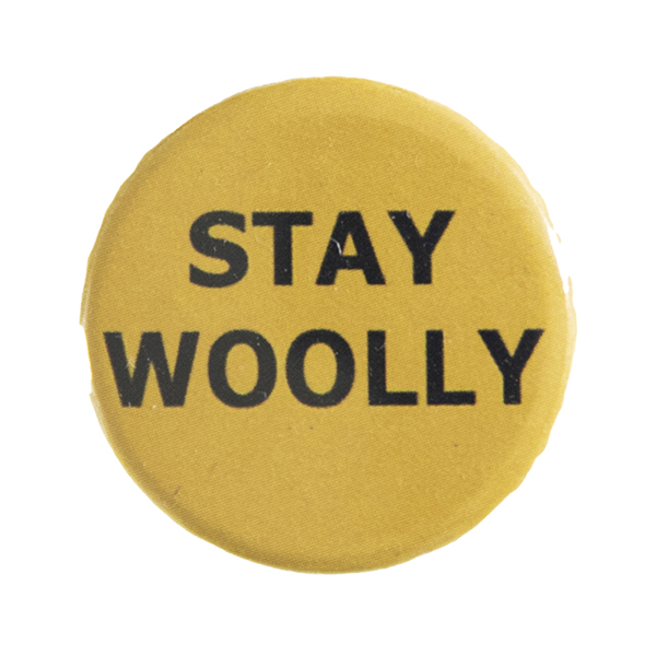 yellow pin badge with text "STAY WOOLLY"