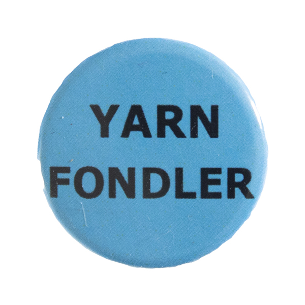 blue pin badge with text "YARN FONDLER"