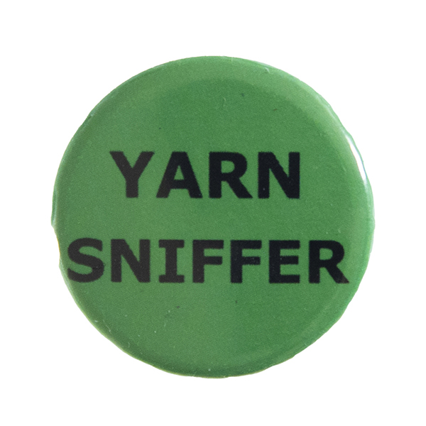 green pin badge with text "YARN SNIFFER"