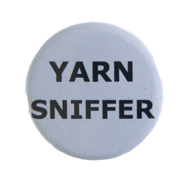 grey pin badge with text "YARN SNIFFER"