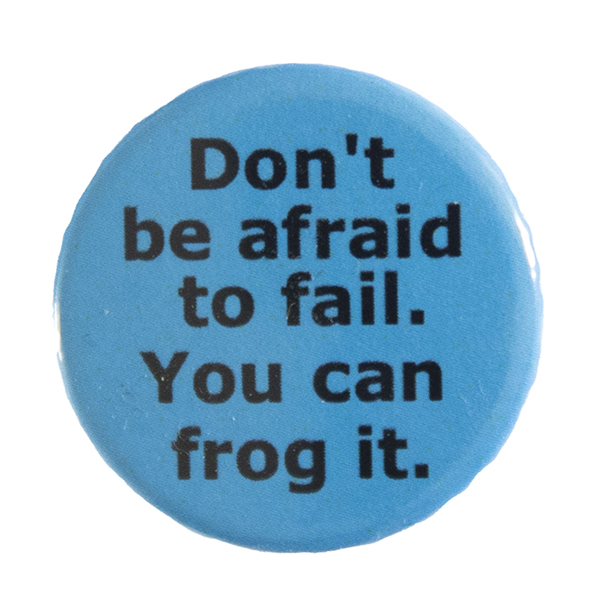 blue pin badge with text "Don't be afraid to fail. You can frog it"