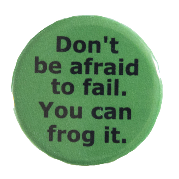 green pin badge with text "Don't be afraid to fail. You can frog it"