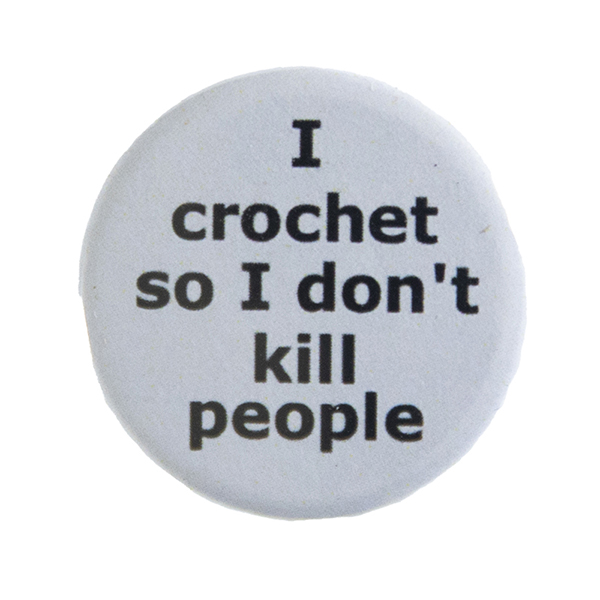 grey pin badge with text "I crochet so I don't kill people"