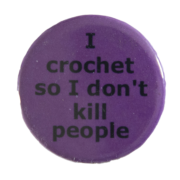 pink pin badge with text "I crochet so I don't kill people"