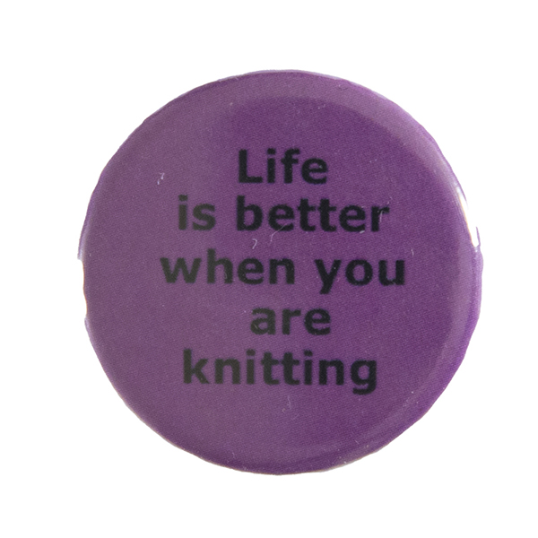 pink pin badge with text "Life is better when you are knitting"