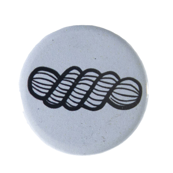 grey pin badge with line drawing of a skein of yarn