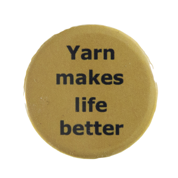 yellow pin badge with text "Yarn makes life better"