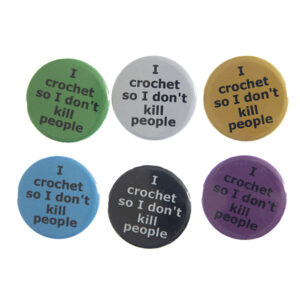 pin badges with text "I crochet so I don't kill people". Badges are green, light grey, yellow. blue, black and pink