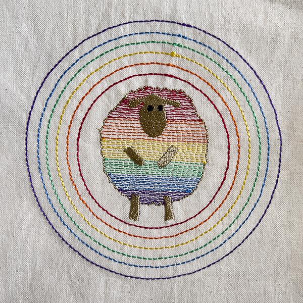 embroidered sheep with rainbow stripes