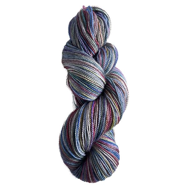 skein of yarn dyed with rainbow colours and tin grey