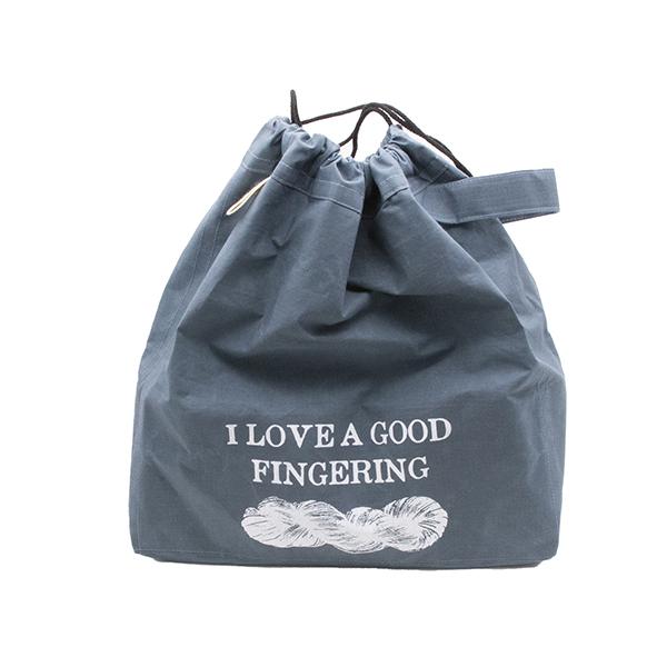 large drawstring project bag in slate blue fabric, wrist strap, drawstring closure, screen printed with text "I LOVE A GOOD FINGERING" and a skein of yarn, shown with drawstrings pulled closed