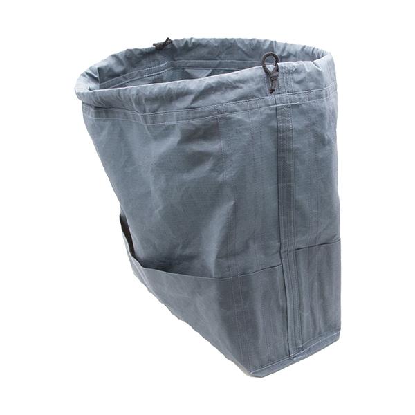 large drawstring project bag in slate blue fabric inside out to show pockets and seams