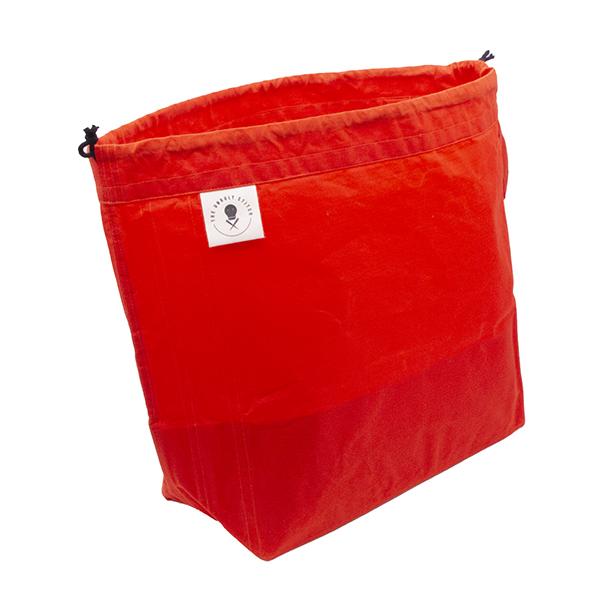 large drawstring project bag in vivid orange fabric, wrist strap, drawstring closure, the unruly stitch label