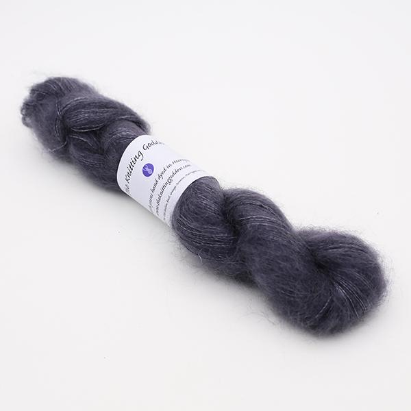 fluffy skein of Moonbroch laceweight yarn in dark grey pewter