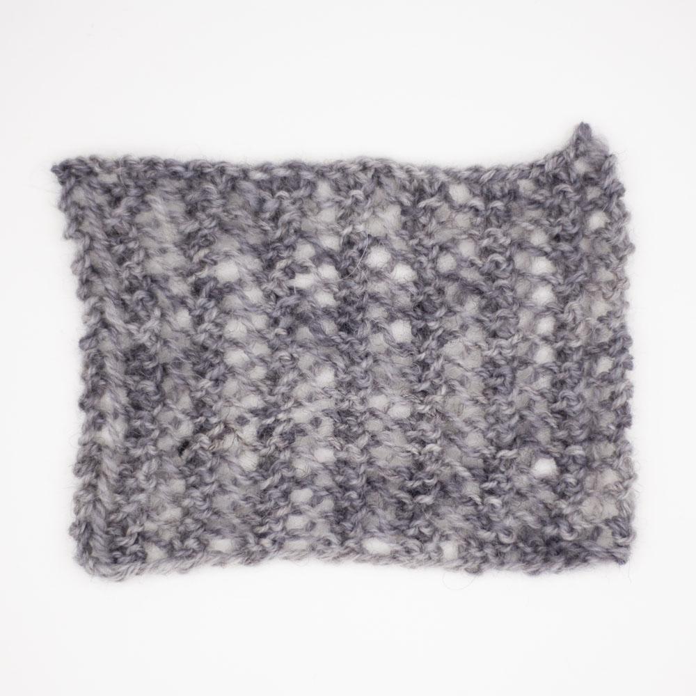 knitted mesh square on 4mm needles sample swatch of baby elephant mid grey tonal Be Reyt yarn