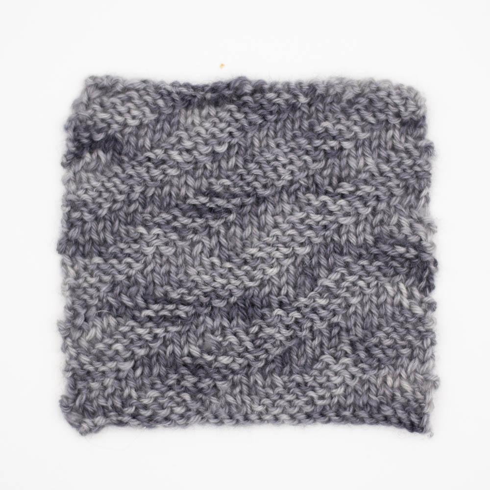 knitted travelling rib sample swatch of baby elephant mid grey tonal BFL yarn