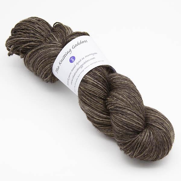 skein of blackened walnut Bluefaced Leicester wool, The Knitting Goddess ball band