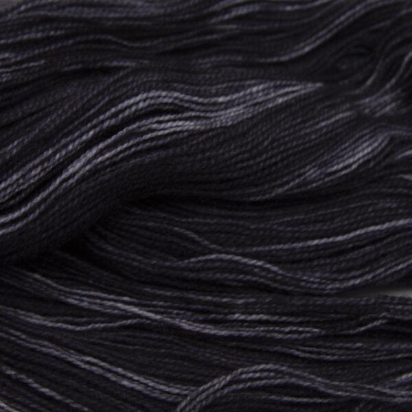 black hand dyed sock yarn, close up showing tonal variations