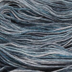 close up of hand dyed bluefaced leicester wool in blackened turquoise a turquoise blue overdyed with black