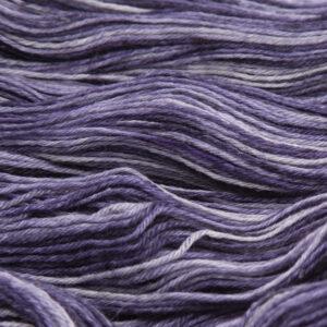 close up of hand dyed bluefaced leicester wool in blackened violet, a purple overdyed with black