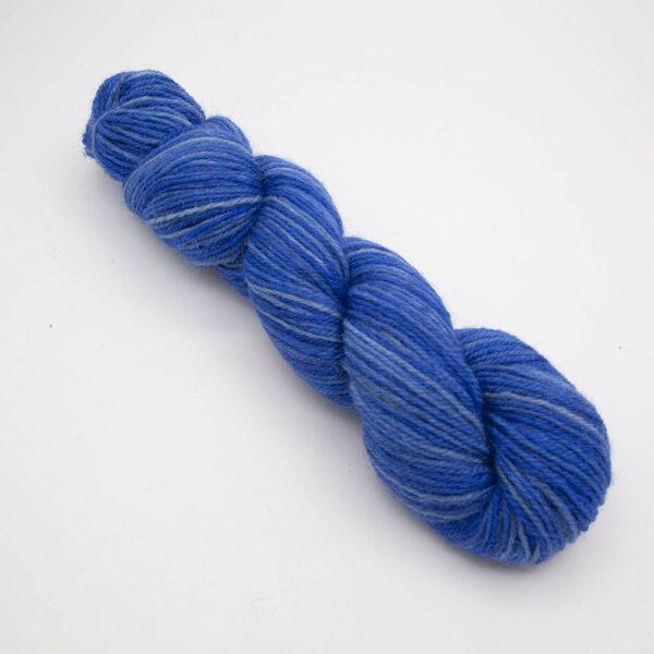 blue hand dyed sock yarn, wound up in a skein