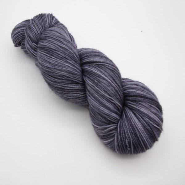 charcoal hand dyed sock yarn, wound up in a skein