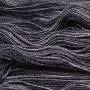 close up of hand dyed bluefaced leicester wool in charcoal, a mid grey