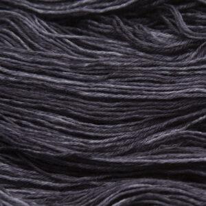 close up of hand dyed bluefaced leicester wool in coal, a dark grey
