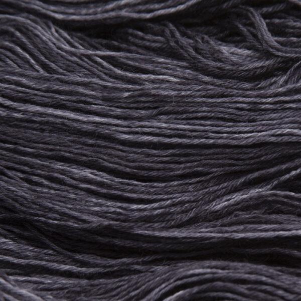 close up of hand dyed bluefaced leicester wool in coal, a dark grey
