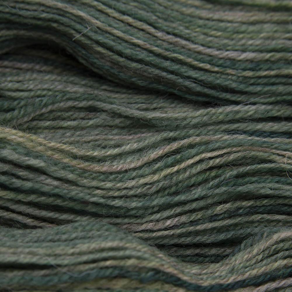 forest (warm olive green) hand dyed sock yarn, close up showing tonal variations