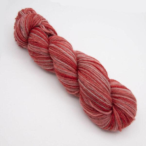 geranium hand dyed sock yarn, wound up in a skein