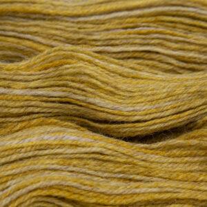 gold hand dyed sock yarn, close up showing tonal variations