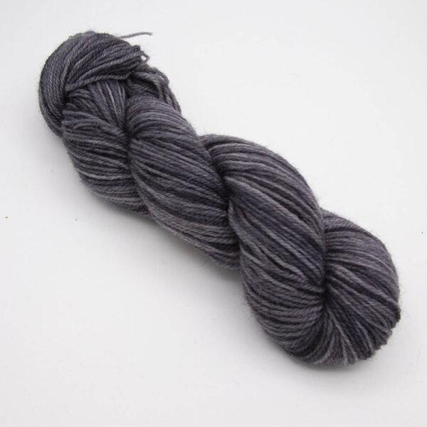 gunmetal hand dyed sock yarn, wound up in a skein