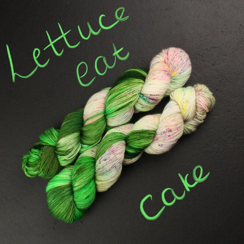 two skeins of Lettuce eat cake yarn, a blend of greens and neon speckles from Rusty Ferret Yarn