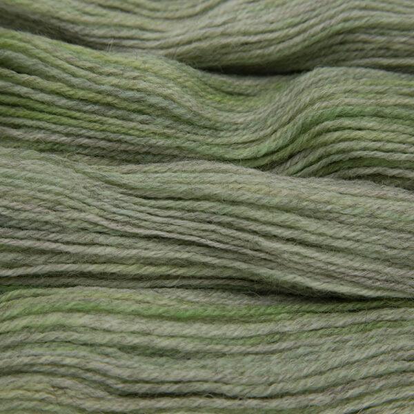 lime green hand dyed sock yarn, close up showing tonal variations