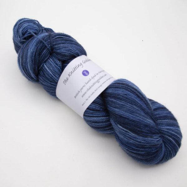navy hand dyed sock yarn, wound up in a skein, The Knitting Goddess ball band