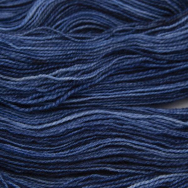 navy blue hand dyed sock yarn, close up showing tonal variations