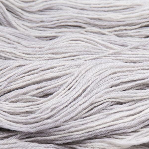 close up of hand dyed bluefaced leicester wool in pearl, a pale grey