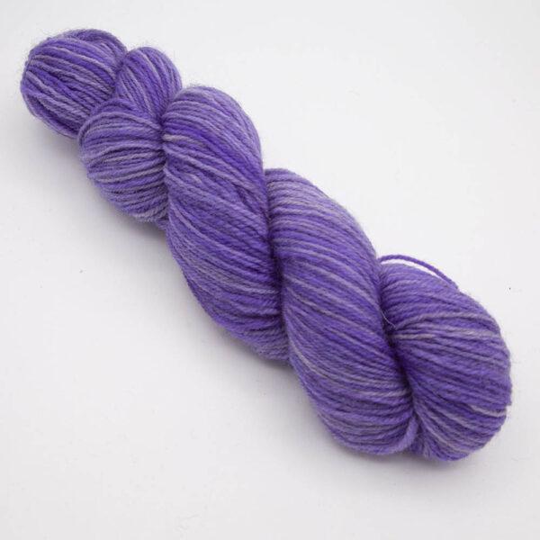 purple hand dyed sock yarn, wound up in a skein