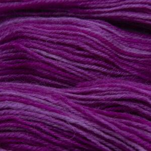 raspberry pink hand dyed sock yarn, close up showing tonal variations