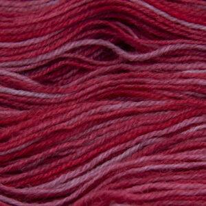 red hand dyed sock yarn, close up showing tonal variations