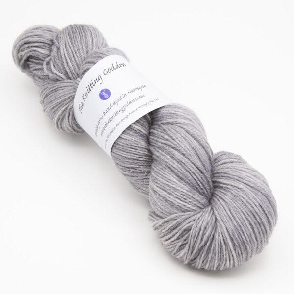 skein of silver Bluefaced Leicester wool, The Knitting Goddess ball band