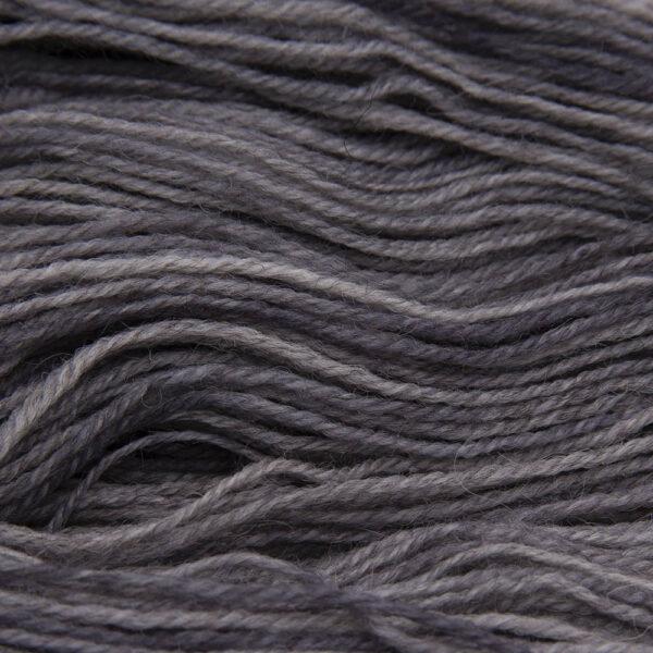 silver (mid grey) hand dyed sock yarn, close up showing tonal variations