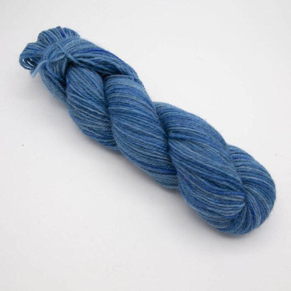 teal hand dyed sock yarn, wound up in a skein