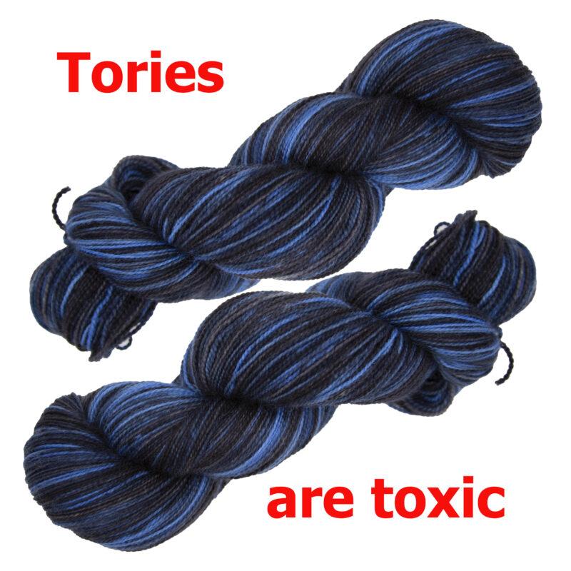 two skeins of black nd blue yarn with the text "TORIES ARE TOXIC"