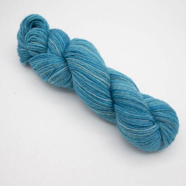 turquoise hand dyed sock yarn, wound up in a skein