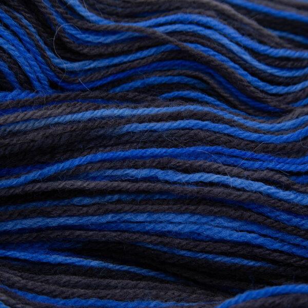 close up of bigger on the inside DK sock wool dyed with blue and black