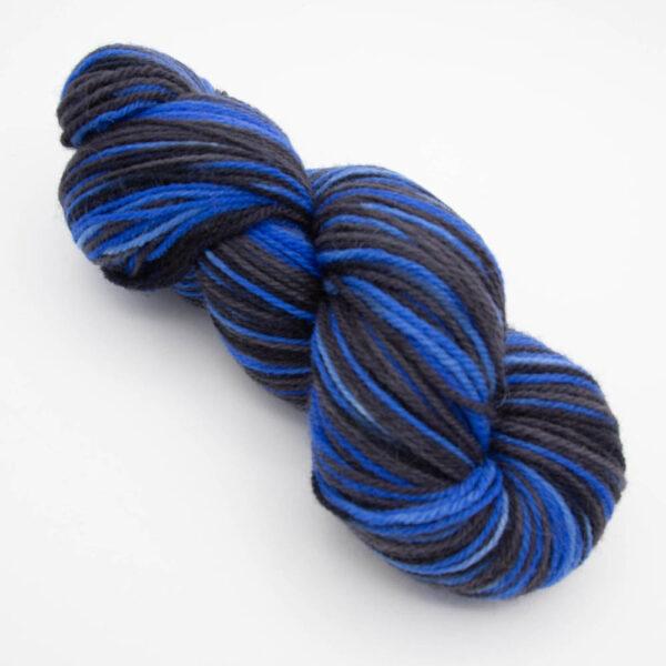 skein of bigger on the inside DK sock wool dyed with blue and black